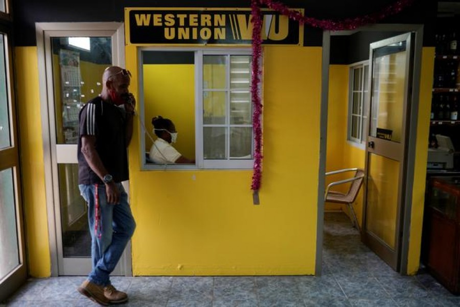 A man talks on the phone outside a Western Union office, in Havana, Cuba, October 28, 2020. REUTERS/Alexandre Meneghini