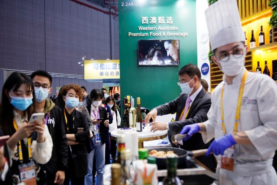 A chef cooks Australian lobster at an Australia's food booth at the third China International Import Expo (CIIE) in Shanghai, China Nov 6, 2020. REUTERS