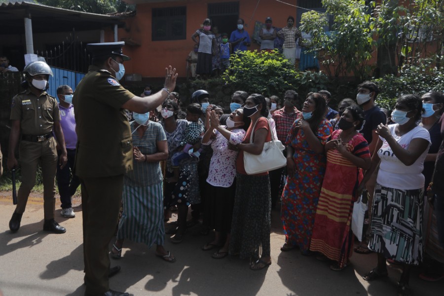 Family members of inmates gather demanding to know the condition of their relatives outside the Mahara prison complex following an overnight unrest in Mahara, outskirts of Colombo, Sri Lanka, Monday, Nov. 30, 2020. AP Photo/Eranga Jayawardena