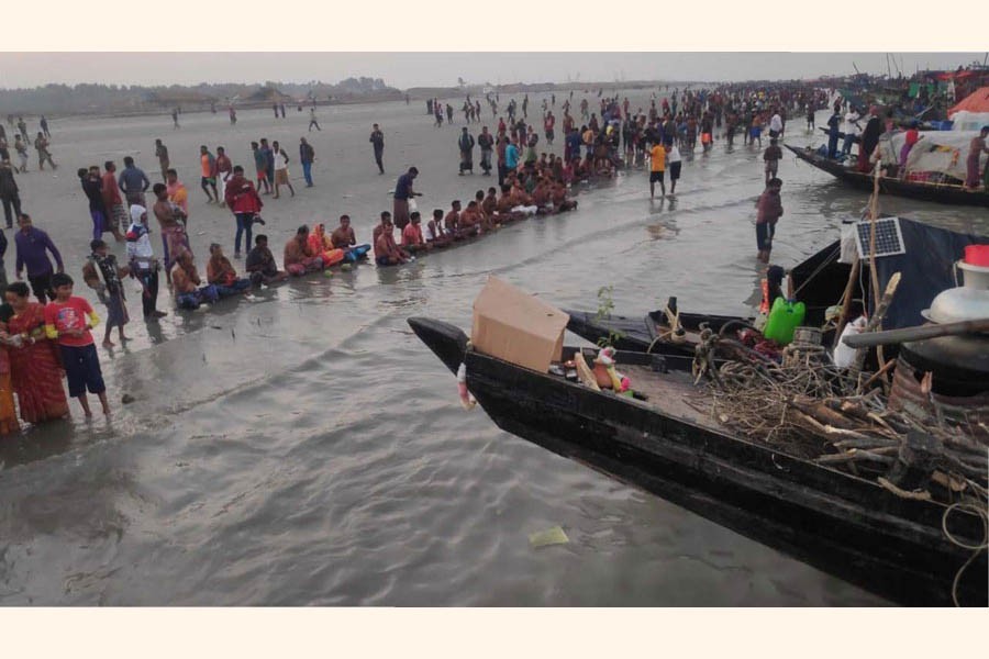 Hindu worshippers take a holy bath in Bay of Bengal on Monday — FE Photo