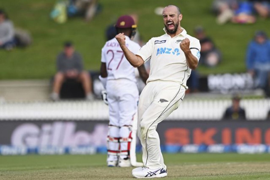 New Zealand's Daryl Mitchell celebrates the wicket of West Indies' Jason Holder during play on day three of their first Test in Hamilton — AP photo