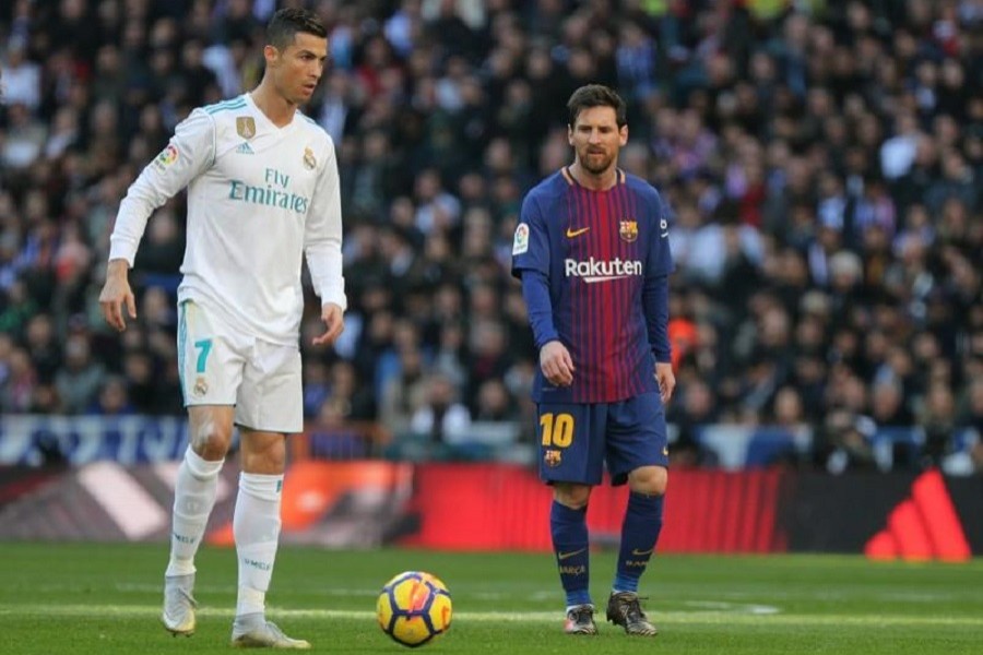 Football - La Liga Santander - Real Madrid vs FC Barcelona - Santiago Bernabeu, Madrid, Spain - December 23, 2017 Real Madrid’s Cristiano Ronaldo in action with Barcelona’s Lionel Messi — Reuters/Files