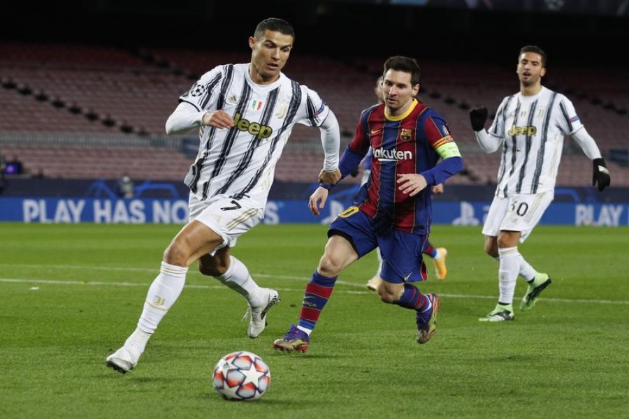 Champions League - Group G - FC Barcelona v Juventus - Camp Nou, Barcelona, Spain - December 8, 2020 FC Barcelona's Lionel Messi in action with Juventus' Cristiano Ronaldo REUTERS/Albert Gea