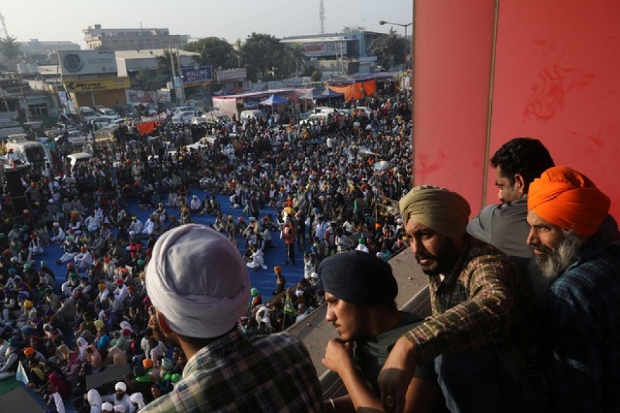 Farmers attend a protest during a nationwide strike against the newly passed farm bills at Singhu border near Delhi, India, Dec 8, 2020. REUTERS