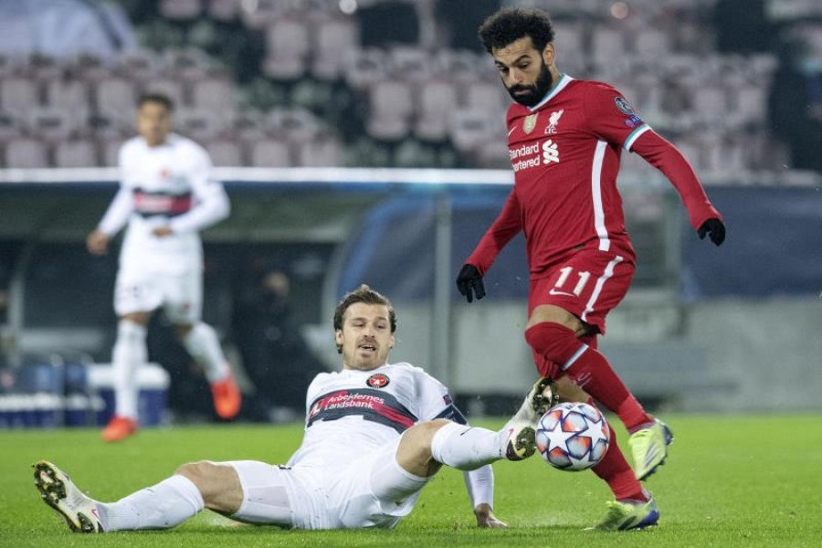 FC Midtjylland's Erik Sviatchenko in action with Liverpool's Mohamed Salah during the Champions League group stage clash on  Wednesday — Via Reuters