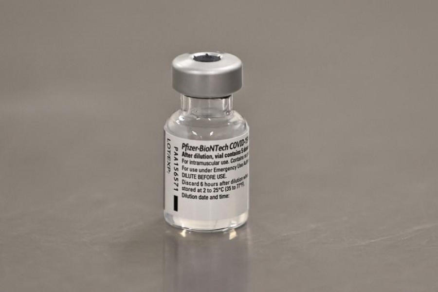 A vial of the Pfizer/BioNTech COVID-19 vaccine is seen ahead of being administered at the Royal Victoria Hospital, on the first day of the largest immunization program in the British history, in Belfast, Northern Ireland December 8, 2020. Liam McBurney/Pool via REUTERS/File Photo