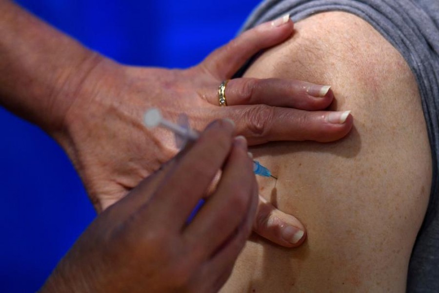 A nurse administers the Pfizer/BioNTech Covid-19 vaccine to a man at a vaccination centre, on the first day of the largest immunisation programme in the British history, in Cardiff, Wales, Britain, December 8, 2020 — Reuters/Files