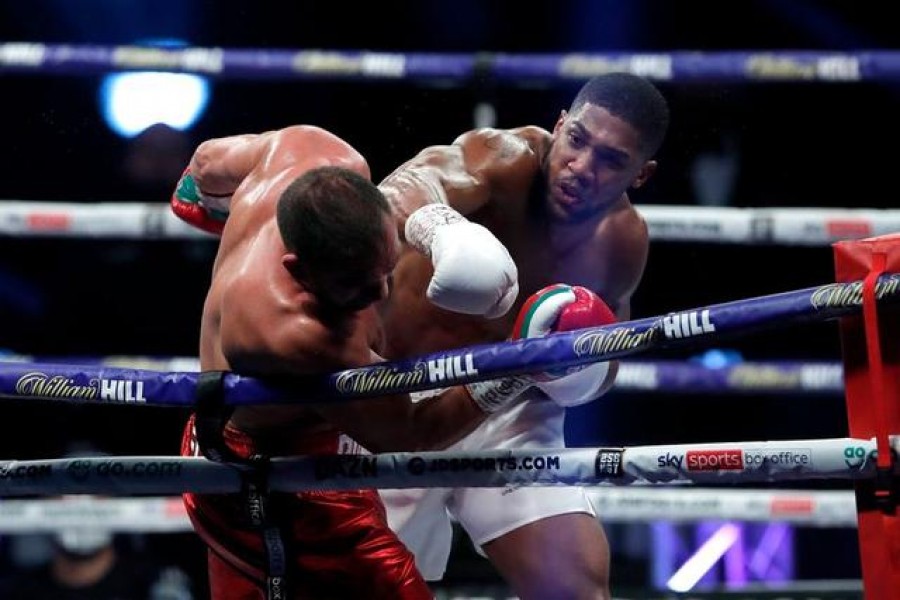 Heavyweight World Title Fight - Anthony Joshua v Kubrat Pulev - The SSE Arena, London, Britain - December 12, 2020 Anthony Joshua in action against Kubrat Pulev Pool via REUTERS/Andrew Couldridge