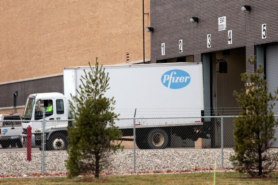 A truck backs into the loading dock of the Pfizer Global Supply manufacturing plant in Portage, Michigan, U.S., December 11, 2020. REUTERS/Rebecca Cook