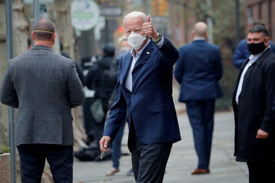 US President-elect Joe Biden gestures as he exits Penn Medicine Pennsylvania Hospital in Philadelphia, Pennsylvania, US on December 12, 2020.