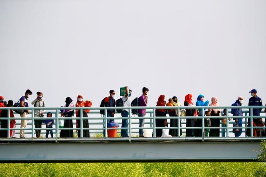 Rohingyas prepare to board a ship as they move to Bhasan Char island near Chattogram, Bangladesh, December 4, 2020 — Reuters/Files