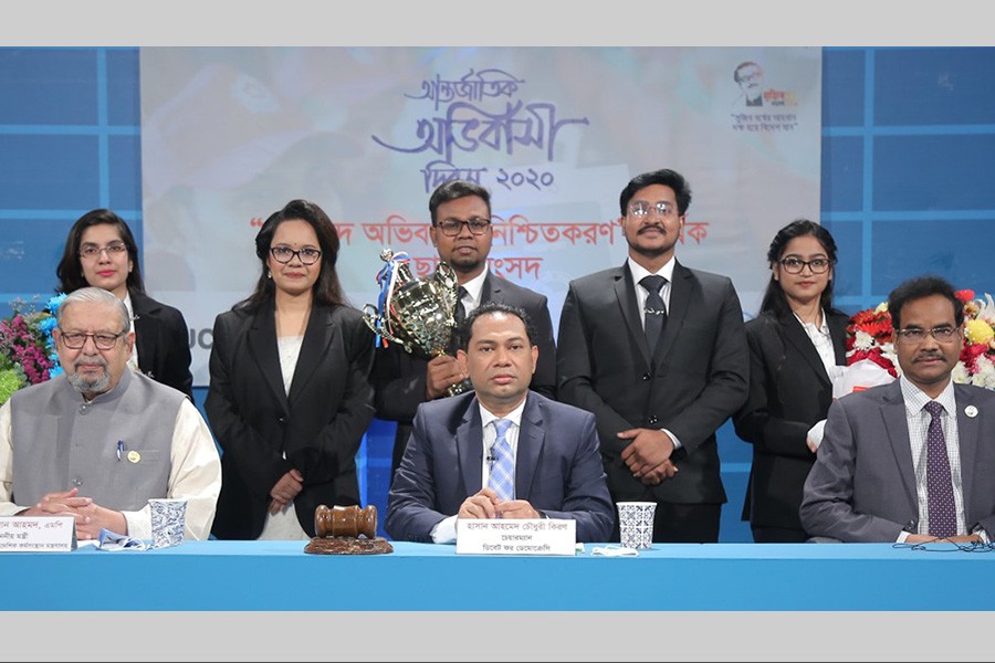 Eastern University debaters, winner in the competition ‘Sending Skilled Worker will Make Sure Safe Migration’, are seen with the Expatriates Welfare Minister Imran Ahmad