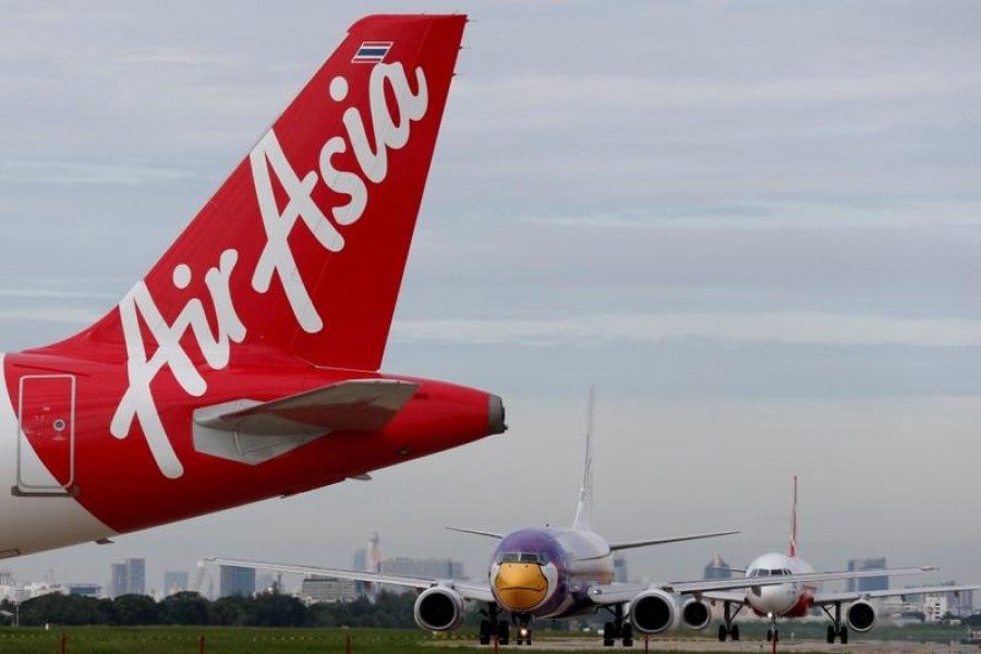 An AirAsia plane prepares for take off at Don Mueang International Airport in Bangkok, Thailand, June 29, 2016. REUTERS/Chaiwat Subprasom