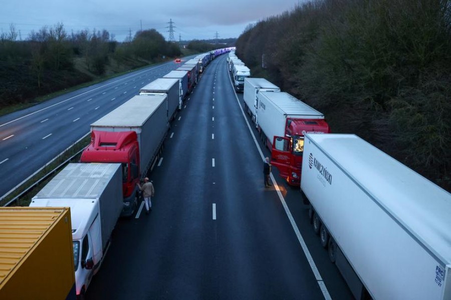 Lorries are seen parked on the M20 motorway, as EU countries impose a travel ban from the UK following the coronavirus disease (COVID-19) outbreak, near Ashford, Britain, December 22, 2020. REUTERS/Simon Dawson