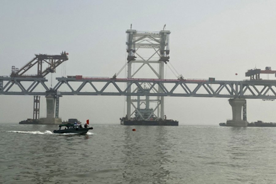 Watching a bridge across Padma   