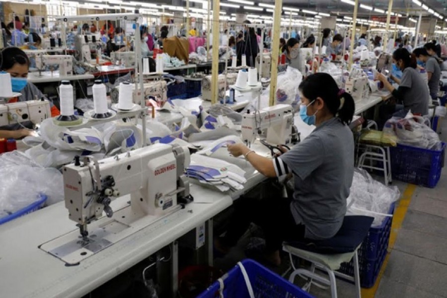 Employees work at a shoe factory for export in Hanoi, Vietnam December 29, 2020. Reuters