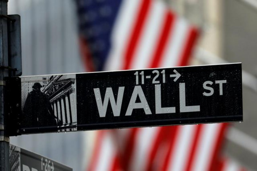 Raindrops hang on a sign for Wall Street outside the New York Stock Exchange in Manhattan in New York City, New York, US, October 26, 2020 — Reuters/Files