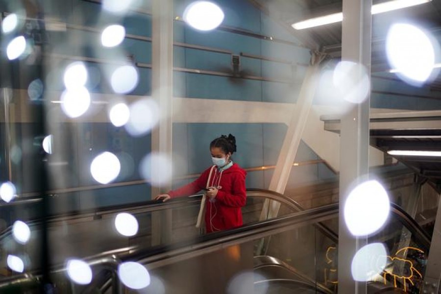 A woman wears a face mask inside a department store, after the Thai government ordered a temporary closure of various public facilities, amid the spread of the coronavirus disease (COVID-19), in Bangkok, Thailand January 2, 2021. REUTERS/Athit Perawongmetha