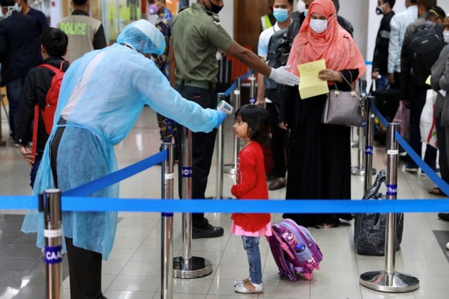 Representational image: A child is being checked with thermal scanner at the Hazrat Shahjalal International Airport as a preventive measure against coronavirus in Dhaka, Bangladesh, March 11, 2020 — Reuters/Files