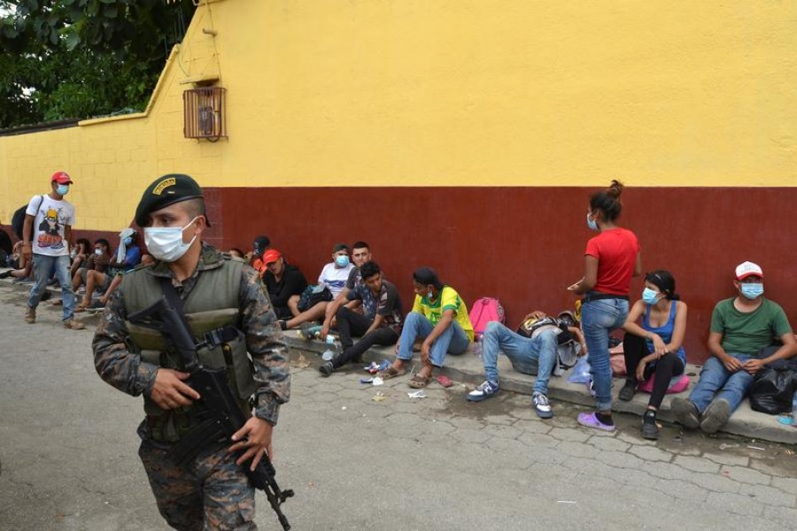 FILE PHOTO: A Guatemalan soldier patrols to prevent a group of Honduran migrants who are trying to reach the US, from moving towards the Guatemala and Mexico border, as they sit outside the migrant shelter, in Tecun Uman, Guatemala October 3, 2020. REUTERS/Jose Torres