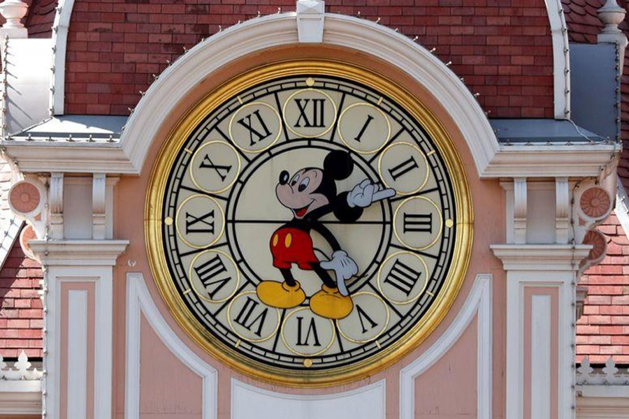 Disney character Mickey Mouse is seen on a clock at the entrance of Disneyland Paris, in Marne-la-Vallee, near Paris, as the theme park prepares to reopen its doors to the public following the coronavirus disease (Covid-19) outbreak in France on July 9, 2020 — Reuters/Files