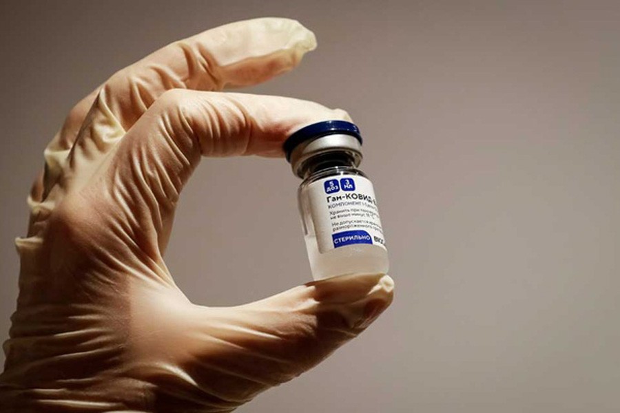 A medical specialist holds a vial of Sputnik V vaccine against the coronavirus in a department store in Moscow, Russia, Jan 18, 2021 REUTERS