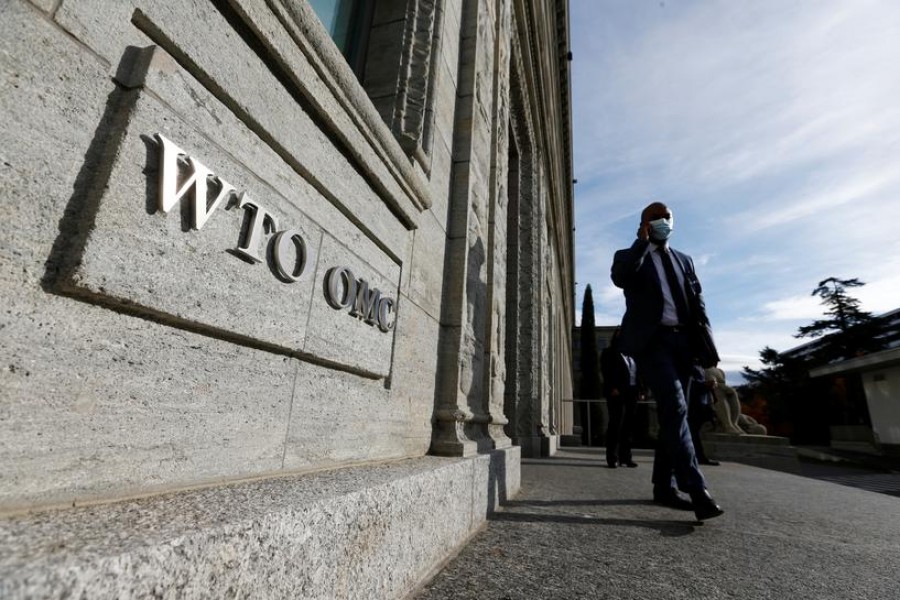 A delegate arrives before a meeting at the World Trade Organization (WTO) in Geneva, Switzerland on October 28, 2020 — Reuters/Files