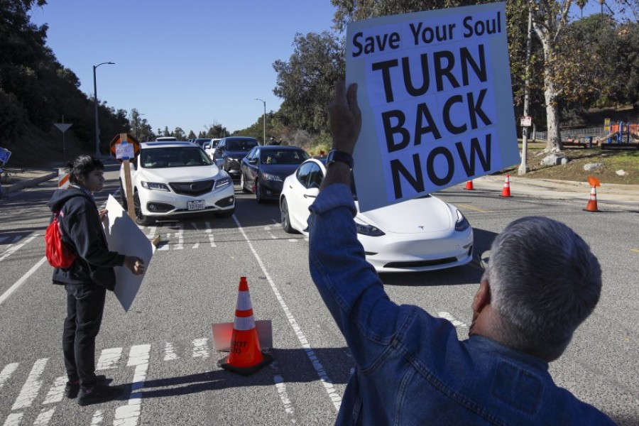 Shop Mask Free Los Angeles organised a protest on Saturday at the Dodger Stadium Covid-19 vaccination site, rallying against the vaccines, masks and lockdowns —  Los Angeles Times