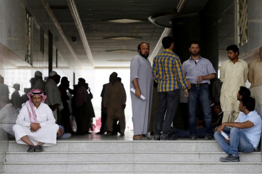 Migrant workers, who work for Saudi Binladin Group, gather as they ask for a final settlement over salary issue, in Riyadh, Saudi Arabia, March 29, 2016 — Reuters/Files