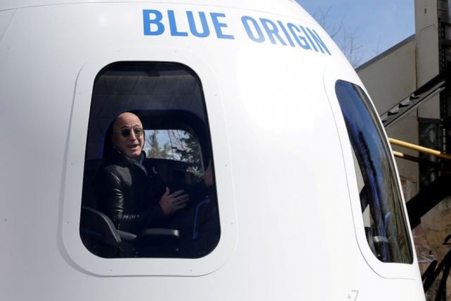 Amazon and Blue Origin founder Jeff Bezos addresses the media about the New Shepard rocket booster and Crew Capsule mockup at the 33rd Space Symposium in Colorado Springs, Colorado, United States, April 05, 2017 — Reuters/Files