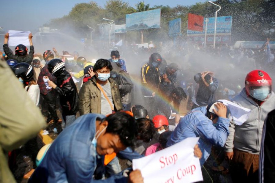 Police fire a water cannon at protesters rallying against the military coup and to demand the release of elected leader Aung San Suu Kyi, in Naypyitaw, Myanmar on February 9, 2021 — Reuters photo