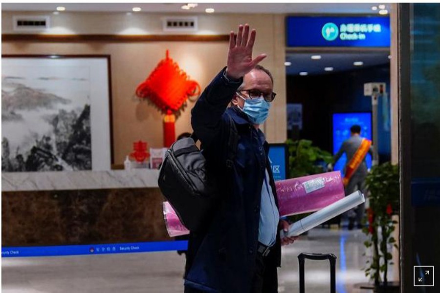 Peter Ben Embarek, a member of the World Health Organization (WHO) team tasked with investigating the origins of the coronavirus disease (COVID-19), waves as he arrives at the airport to leave Wuhan, Hubei province, China February 10, 2021. REUTERS/Aly Song