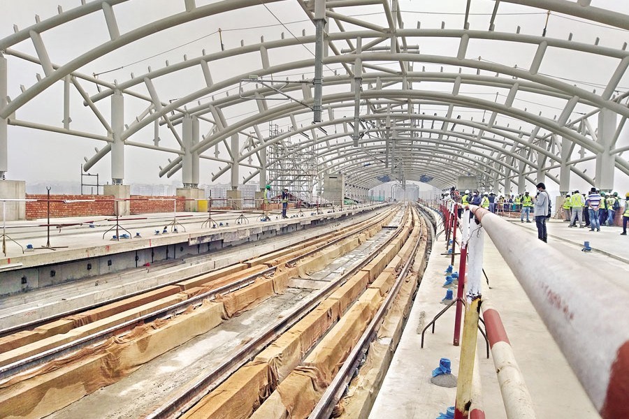 Construction work of a station of the mass rapid transit (MRT) line-6 going on at Uttara in the city, as the dream of the first-ever metro rail project in the country is turning into a reality, bit by bit. The photo was taken on Wednesday — FE Photo