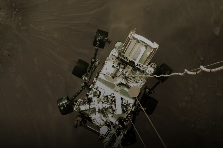 NASA's Perseverance rover descends to touch down on Mars in a still image from a video camera aboard the descent stage taken February 18, 2021. NASA/JPL-Caltech/Handout via REUTERS