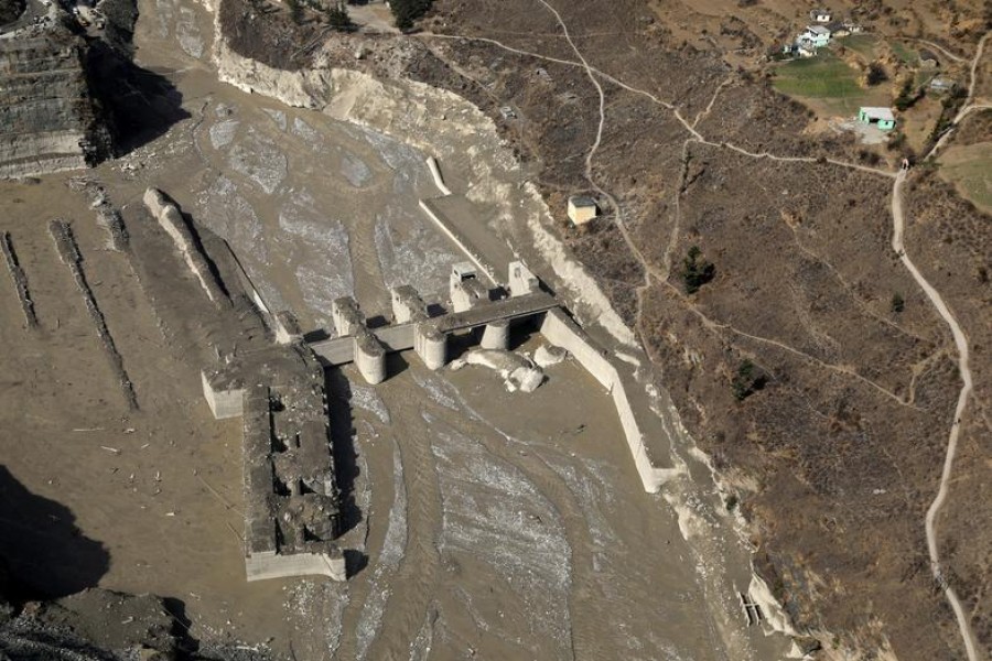 FILE PHOTO: An aerial view shows a damaged barrage after a flash flood swept a mountain valley destroying dams and bridges, in Tapovan in the northern state of Uttarakhand, India, February 12, 2021. REUTERS/Anushree Fadnavis