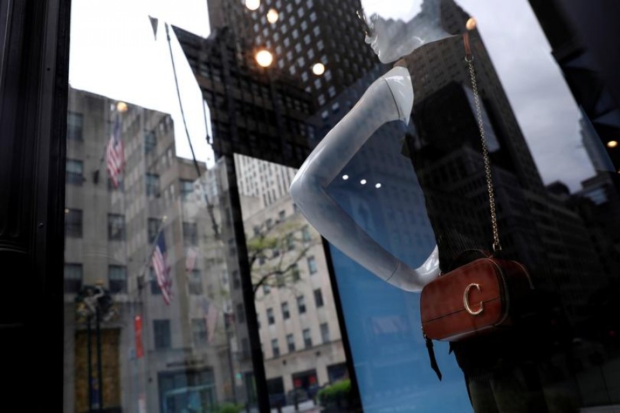 FILE PHOTO: Mannequins are seen inside a closed Gucci store on 5th Avenue, during the outbreak of the coronavirus disease (COVID-19), in Manhattan, New York city, New York, US, May 11, 2020. REUTERS/Mike Segar