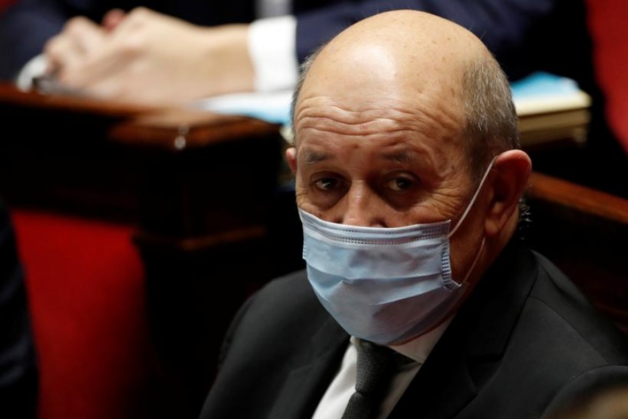 FILE PHOTO: French Foreign Minister Jean Yves Le Drian, wearing a protective face mask, attends the questions to the government session at the National Assembly in Paris amid the coronavirus disease (COVID-19) outbreak in France, January 26, 2021. REUTERS/Gonzalo Fuentes