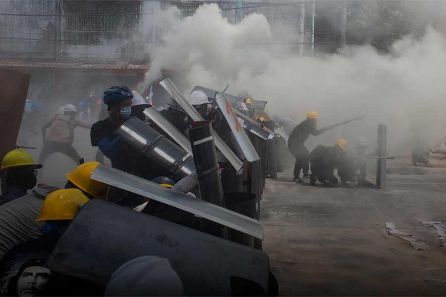 Protesters cover with makeshift shields during an anti-coup protest in Yangon of Myanmar on Wednesday -Reuters photo