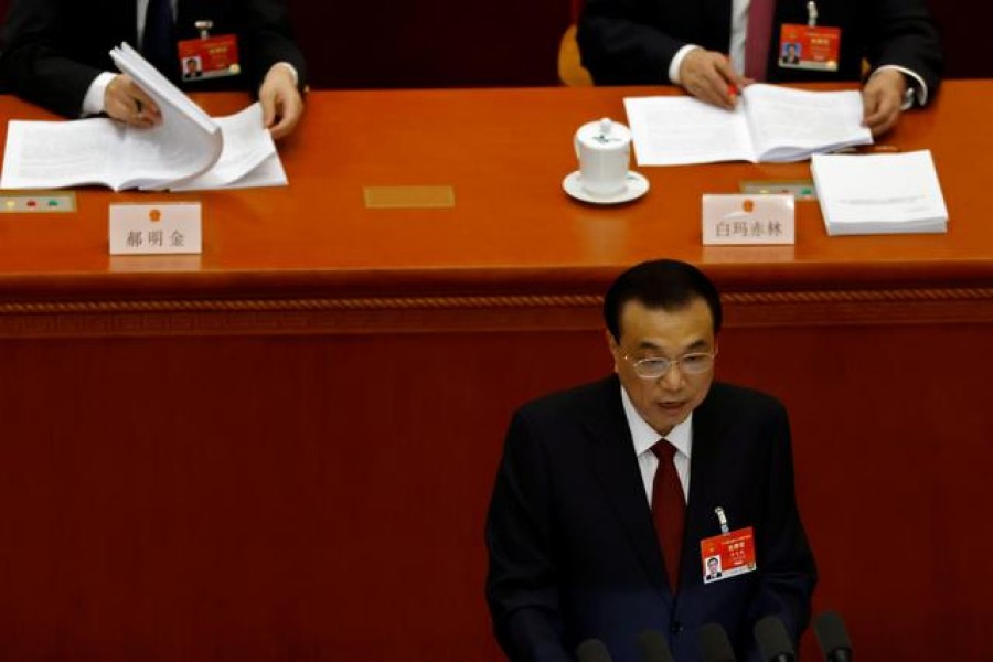 Chinese Premier Li Keqiang speaks at the opening session of the National People's Congress (NPC) at the Great Hall of the People in Beijing, China March 5, 2021. REUTERS/Carlos Garcia Rawlins