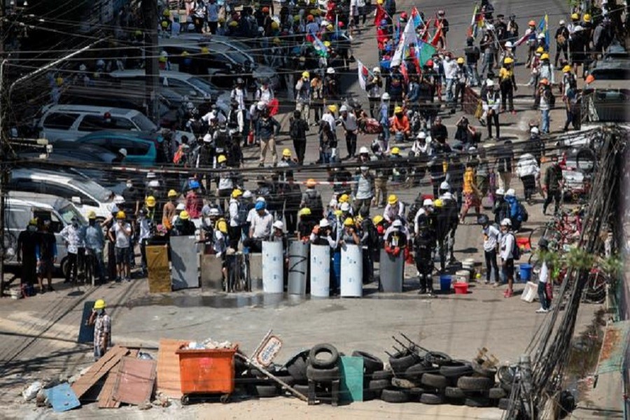 Demonstrators block a road during an anti-coup protest in Yangon, Myanmar, March 4, 2021 — Reuters/Stringer