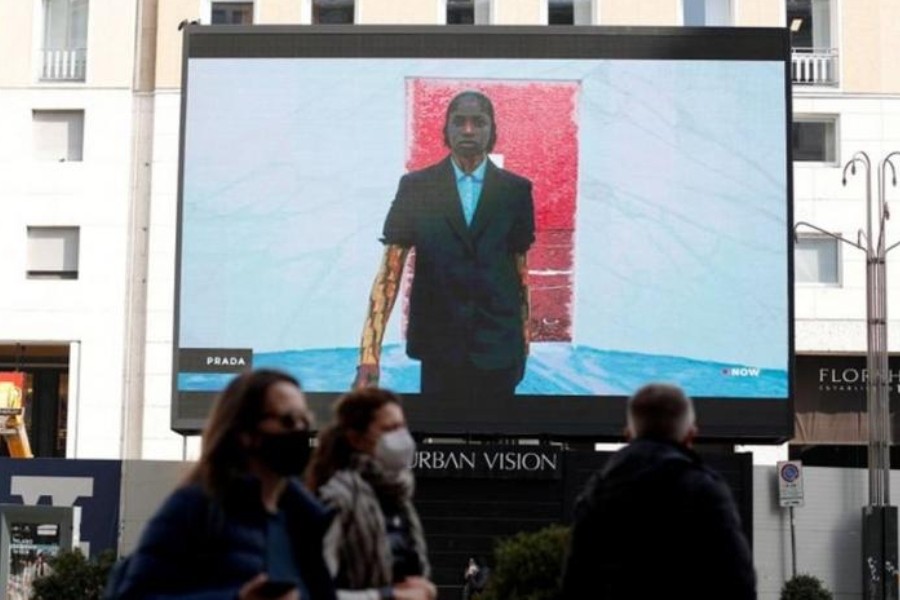 A giant screen set up in San Babila square streams the Prada Fall/Winter 2021/2022 digital show during Fashion Week in Milan, Italy, February 25, 2021. (Reuters)