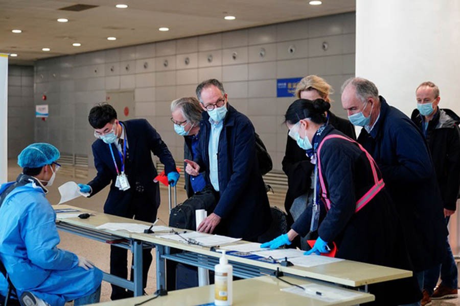 Peter Ben Embarek, and other members of the World Health Organisation (WHO) team tasked with investigating the origins of the coronavirus disease (COVID-19), arrive at the Pudong International Airport in Shanghai, China February 10, 2021. Reuters