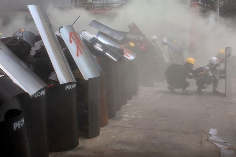 Protesters cover with makeshift shields during an anti-coup protest in Yangon, Myanmar, March 3, 2021. REUTERS/Stringer