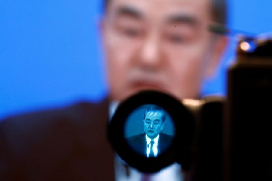 Chinese State Councillor and Foreign Minister Yi attends a news conference in Beijing