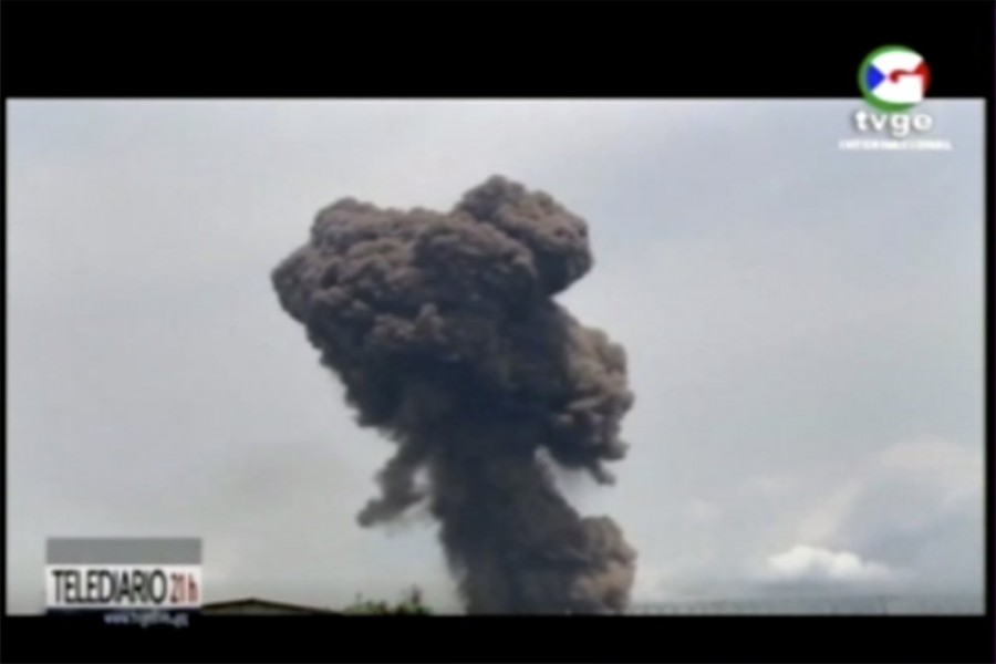 This TVGE image made from video shows smoke rising over the blast site at a military barracks in Bata, Equatorial Guinea, Sunday, March 7, 2021. A series of explosions killed at least 20 people and wounded more than 600 others on Sunday, authorities said. (TVGE via AP)