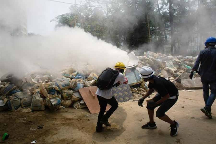 Protesters using fire extinguishers during a protest against the military coup in Yangon, Myanmar, on Sunday –Reuters photo