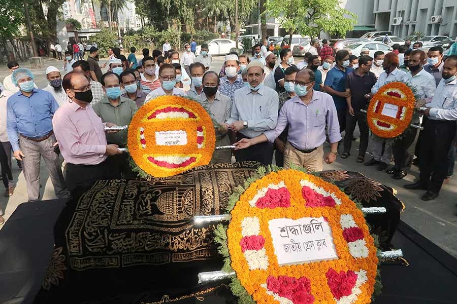 The Financial Express family paying last respect to AZM Anas, the economic editor of the newspaper, after his first namaz-e-janaza at the National Press Club (NPC) premises on Tuesday afternoon –FE Photo