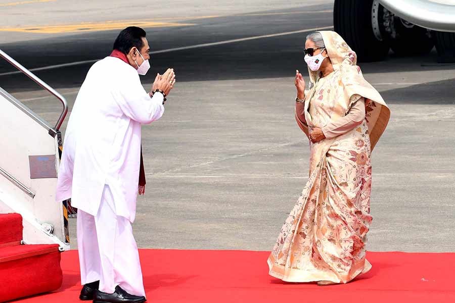 Prime Minister Sheikh Hasina receiving her Sri Lankan counterpart Mahinda Rajapaksha at Hazrat Shahjalal International Airport (HSIA) in Dhaka upon his arrival on Friday morning on a two-day official visit –PID Photo