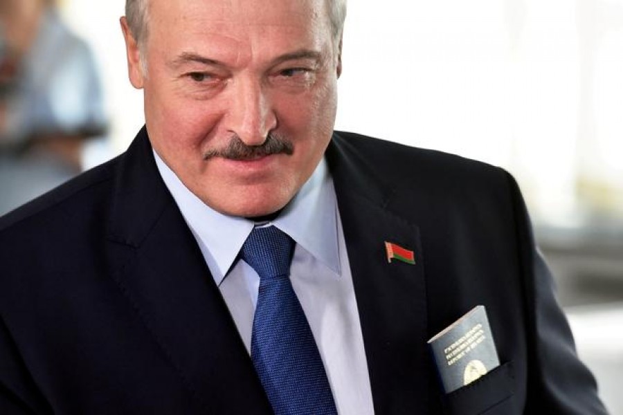 FILE PHOTO: Belarusian President Alexander Lukashenko visits a polling station during the presidential election in Minsk, Belarus August 9, 2020. Sergei Gapon/Pool via REUTERS