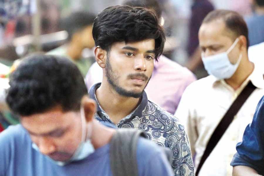 The Covid-19 infection rate has lately been on the rise, especially among the youths, due to negligence in wearing masks as is seen in this photo taken at Paltan of the capital last week— FE file photo